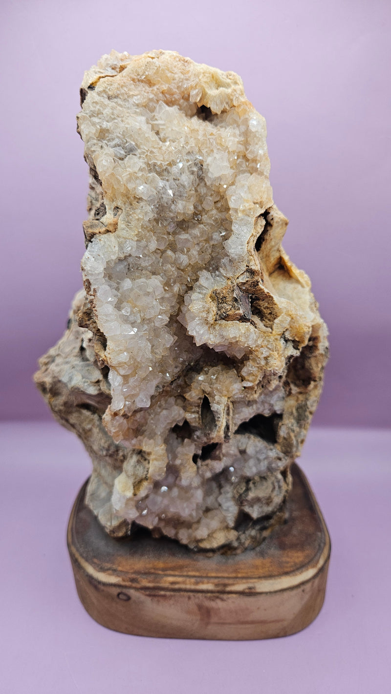 Teak mounted quartz geode with shimmering crystals on a polished wood base, 12x6.25 inches, perfect for home decor