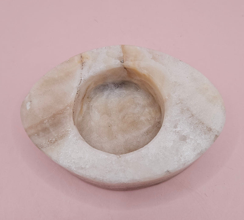 Oval-shaped onyx candle holder in white and brown natural stone, 3.7x2.6x1.2 inches