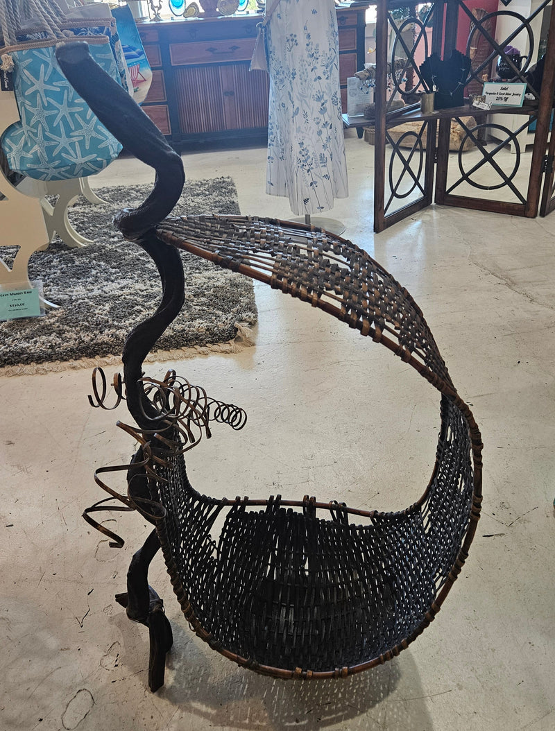 Large abstract wood and woven rattan sculpture with circular form and coil accents, 23.5" x 38".