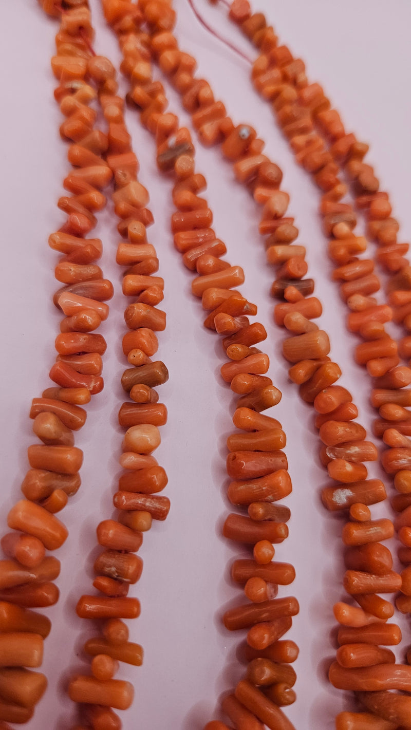 Strand of Mediterranean red coral beads for jewelry making, 60 grams, irregular polished pieces in warm red hues
