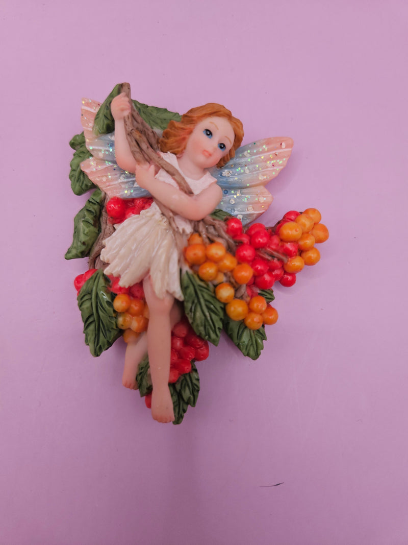 Fairy garden magnets with pastel wings and floral designs, each measuring approximately 3 inches.