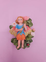 Fairy garden magnets with pastel wings and floral designs, each measuring approximately 3 inches.