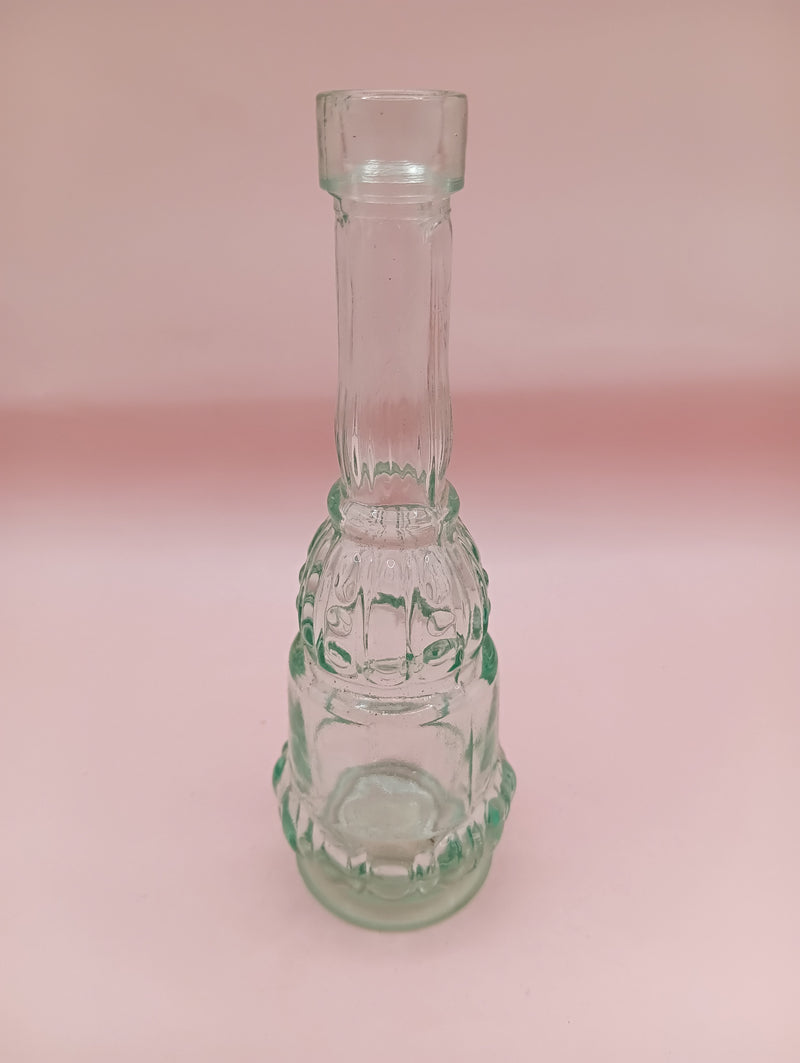 Vintage miniature apothecary-style green glass bottle with figural design