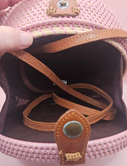 Round rattan crossbody bags in 4 styles—natural, pink, whitewash, and floral weave—with fabric-lined interior