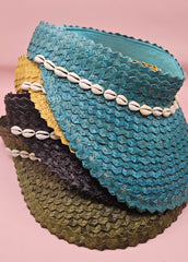  woven palm visors with cowrie shell trim in black, blue, yellow, and green
