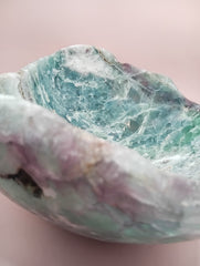 and-carved fluorite bowl featuring layers of green, purple, and aqua crystal