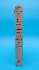1963 first edition hardcover of Notes from a Bottle Found on the Beach at Carmel by Evan S. Connell Jr. with teal illustrated dust jacket and inscription.