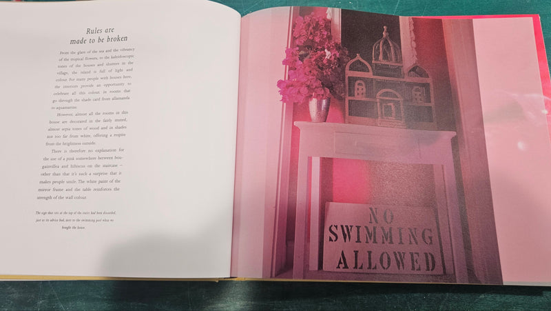 Island Life: Inspirational Interiors by India Hicks & David Flint Wood, showing a serene tropical porch scene with woven furniture and neutral décor.