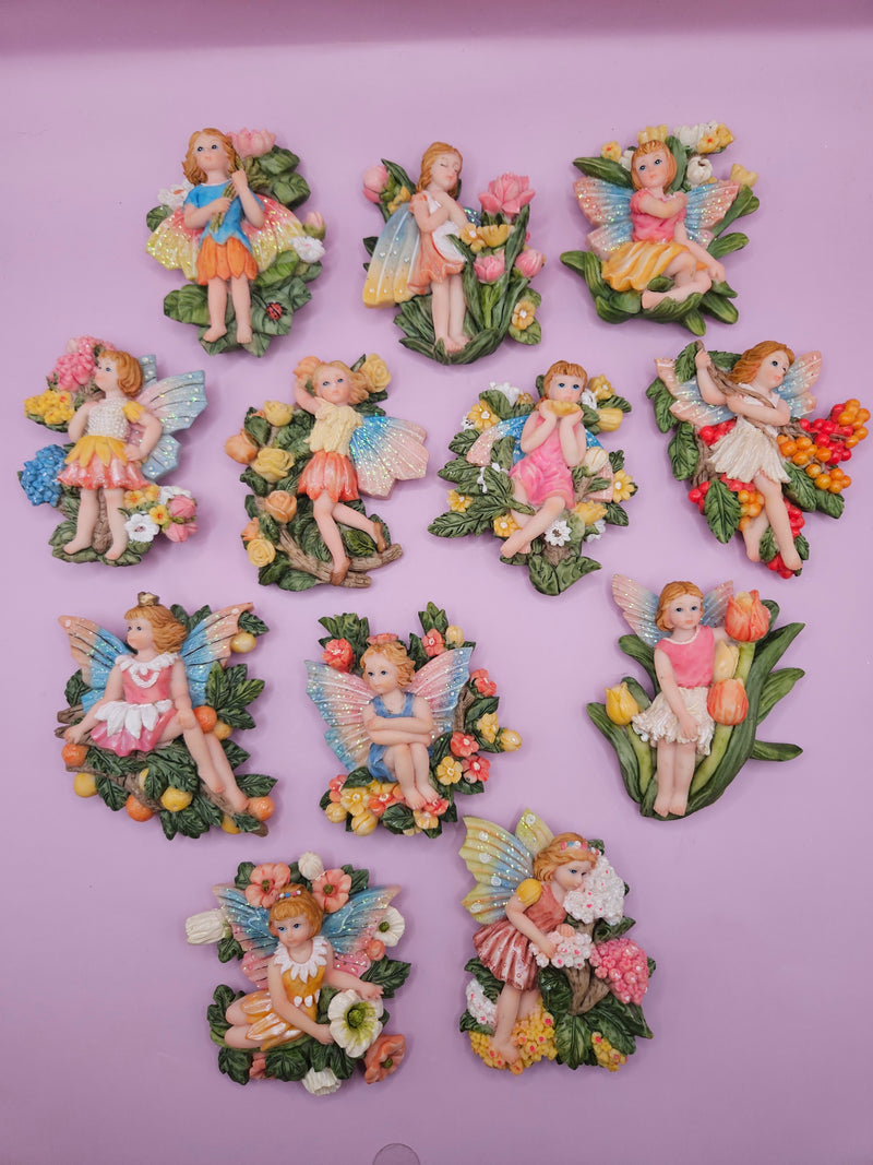 Fairy garden magnets with pastel wings and floral designs, each measuring approximately 3 inches.