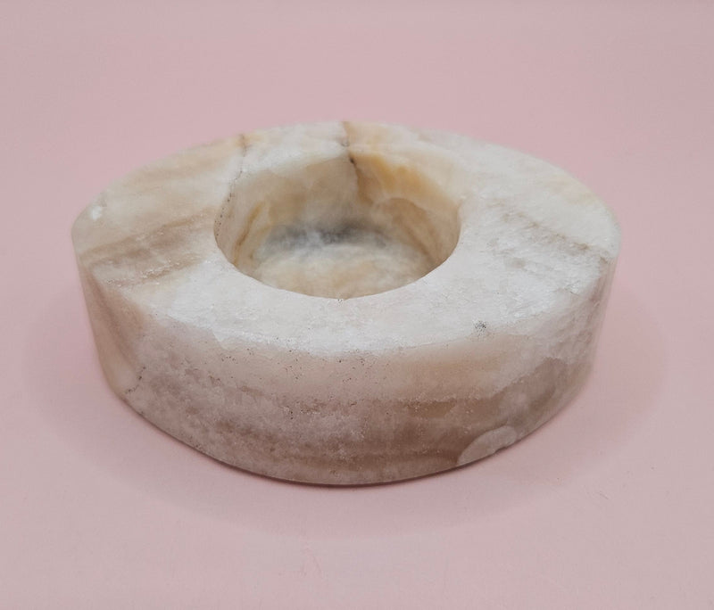 Oval-shaped onyx candle holder in white and brown natural stone, 3.7x2.6x1.2 inches