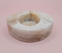 Oval-shaped onyx candle holder in white and brown natural stone, 3.7x2.6x1.2 inches