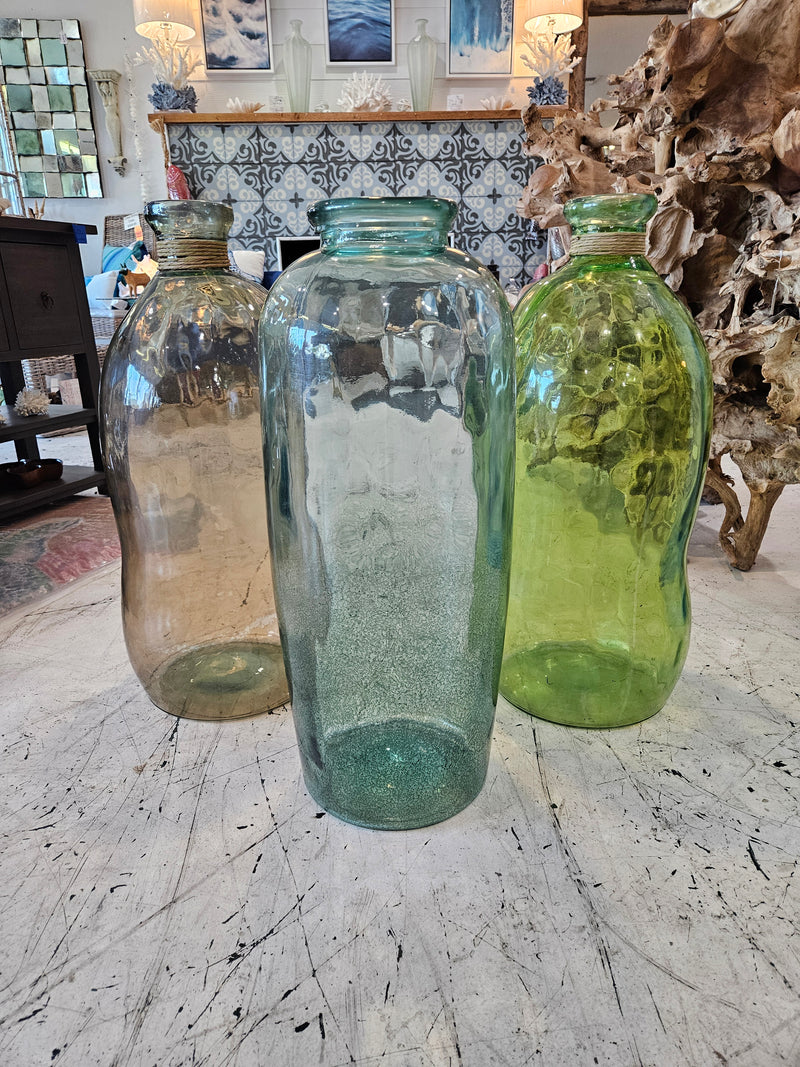  large vintage glass vases, approximately 28.5" x 10", in green and clear tones, ideal for floor decor or statement pieces.