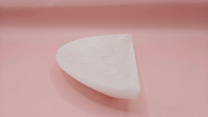 White onyx crescent-shaped shallow bowl with a polished finish.