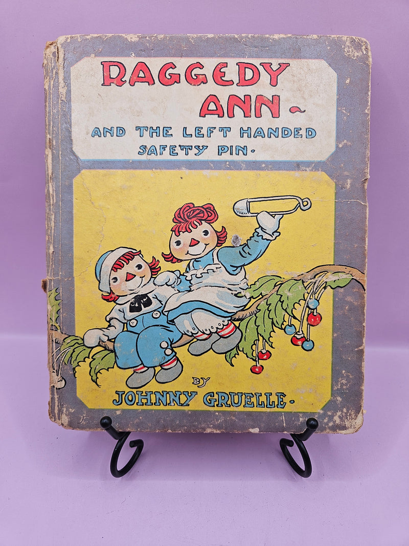 Very rare vintage 1935 edition of Raggedy Ann and the Left Handed Safety Pin by Johnny Gruelle, collectible hardcover book