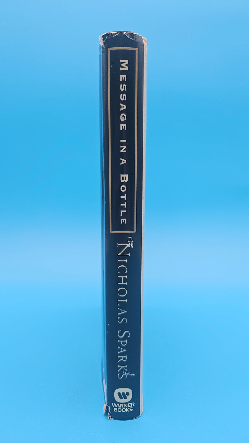 1998 hardcover edition of Message in a Bottle by Nicholas Sparks with dust jacket showing sailboat on ocean waves.