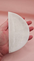 White onyx crescent-shaped shallow bowl with a polished finish.