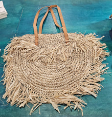 Handwoven round 16-inch straw tote bag with fringe and leather handles