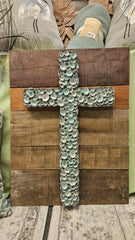 Rustic wooden cross decorated with green-blue limpet shells for coastal wall décor 26x19.75