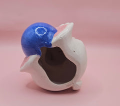 Vintage ceramic bunny rabbit holding a blue egg. 6