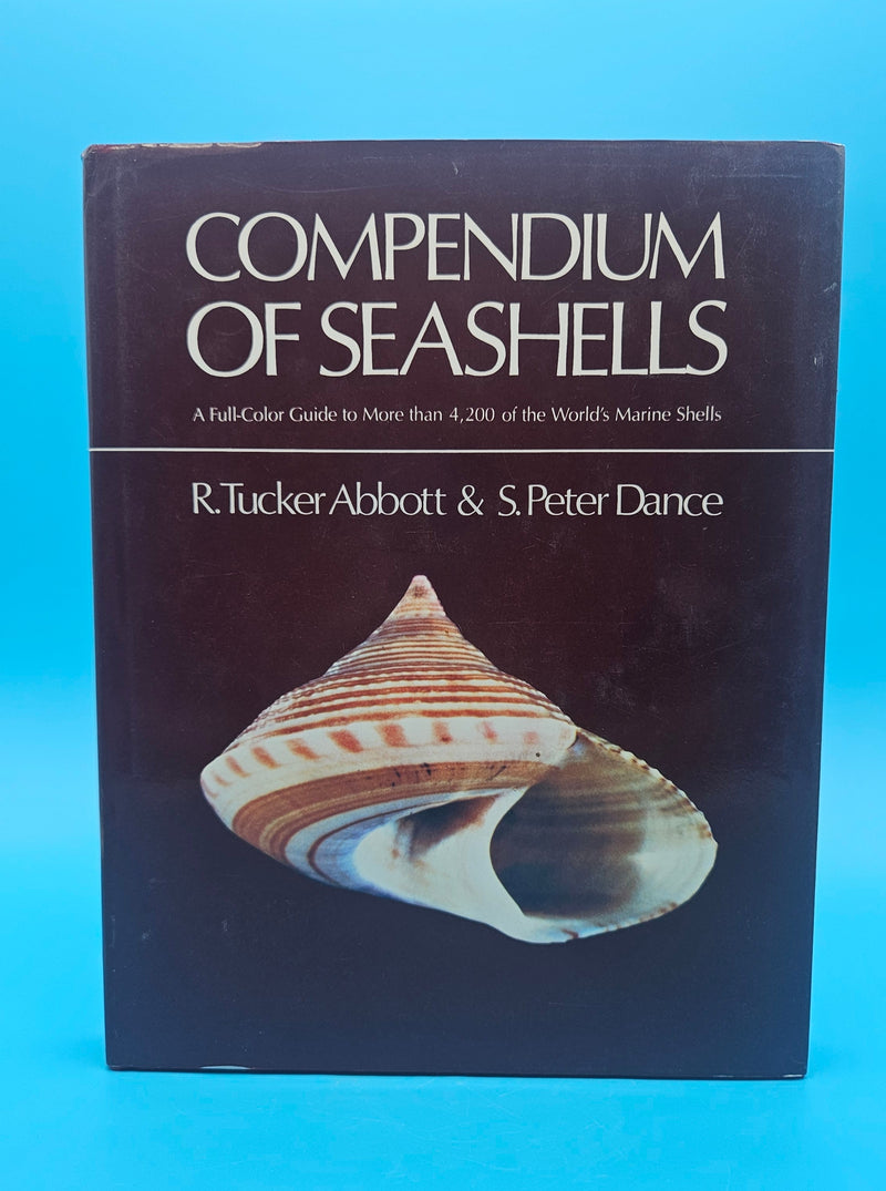 Compendium of Seashells hardcover book by R. Tucker Abbott and S. Peter Dance, 1991 edition with over 4,200 full-color marine shell photographs.