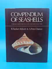 Compendium of Seashells hardcover book by R. Tucker Abbott and S. Peter Dance, 1991 edition with over 4,200 full-color marine shell photographs.