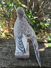 Hand-carved wooden sandpiper preening decor, 10 inches by 7.5 inches, ideal for coastal and nature-themed decor