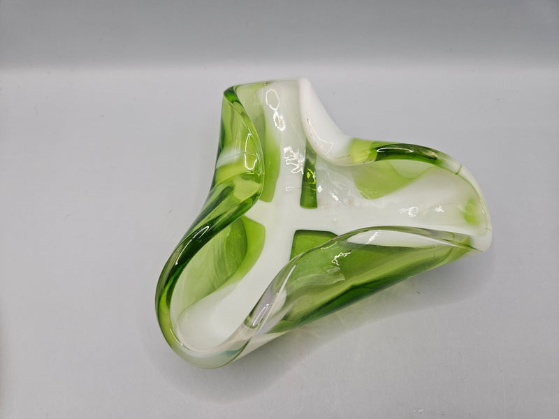 Vintage handcrafted green and white glass bowl with smooth, curved edges. The bowl features a striking translucent green color accented by white swirls, making it a modern decorative piece.