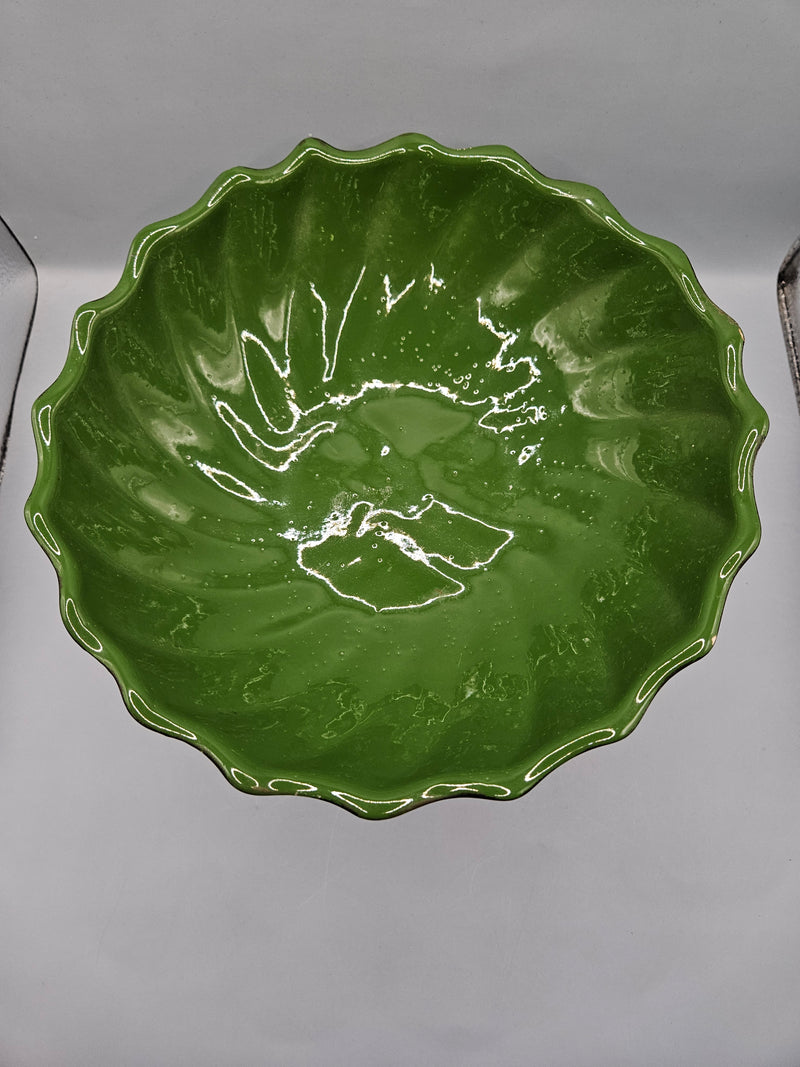 green ceramic scalloped footed bowl measuring 4.75"x8.5", perfect as a decorative centerpiece or functional bowl in any room.