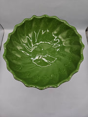 green ceramic scalloped footed bowl measuring 4.75