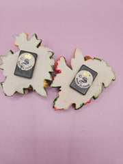 Fairy garden magnets with pastel wings and floral designs, each measuring approximately 3 inches.