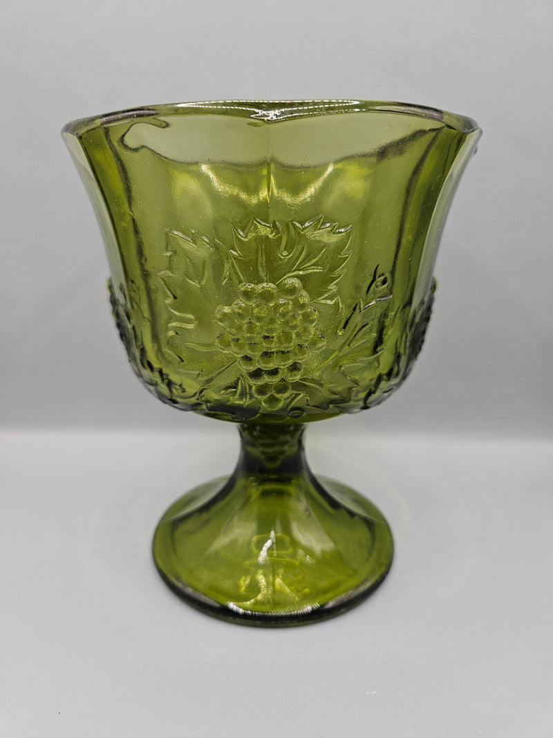  vintage Colony Glass Harvest Green Grape Panel footed planter vase, measuring 6.5"x5.25", featuring grape panel detailing, perfect for home decor or as a planter.

