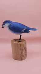 Hand-painted blue songbird figurine on a wood stump, approx. 5.5x2.5 inches