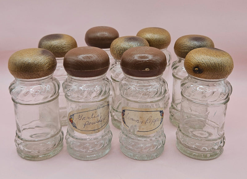 Set of 9 vintage clear glass spice jars with wood-look plastic lids, 3.8 inches tall