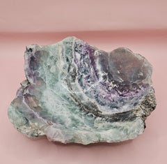 Polished fluorite crystal bowl with green banding, measuring 8 inches wide.