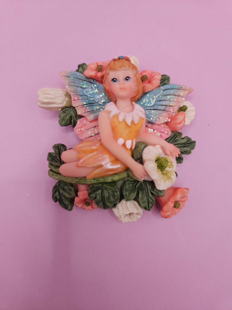 Fairy garden magnets with pastel wings and floral designs, each measuring approximately 3 inches.