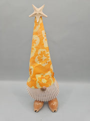 handcrafted seashell gnome with a colorful fabric hat and real seashells, perfect for coastal or beach-themed decor.