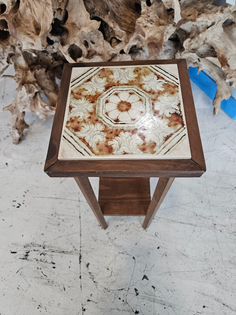 wooden plant stand with floral ceramic tile top and tiered shelves, 27.5 inches tall.