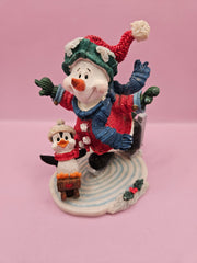 Vintage ice skating snowman and penguin figurine, 4.5 inches tall by 4 inches wide, perfect for holiday decor and winter displays