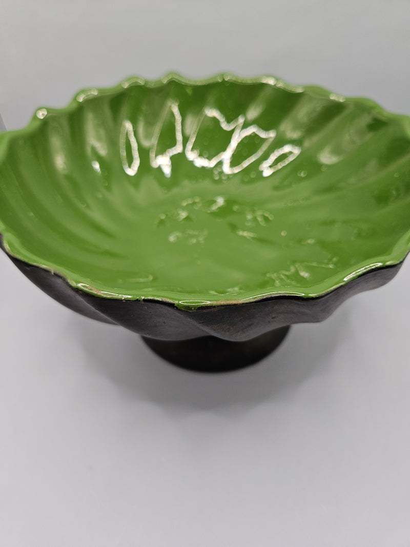 green ceramic scalloped footed bowl measuring 4.75"x8.5", perfect as a decorative centerpiece or functional bowl in any room.