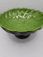 green ceramic scalloped footed bowl measuring 4.75