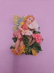 Fairy garden magnets with pastel wings and floral designs, each measuring approximately 3 inches.