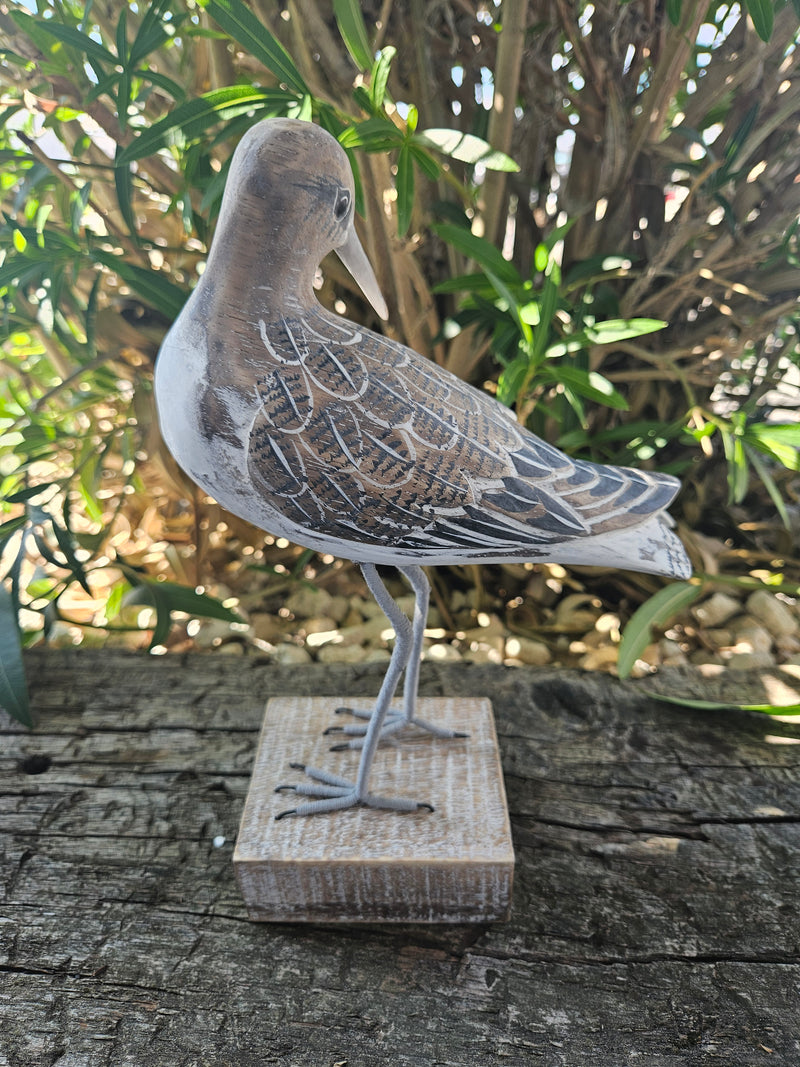 Hand-carved wooden sandpiper preening decor, 10 inches by 7.5 inches, ideal for coastal and nature-themed decor