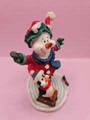 Vintage ice skating snowman and penguin figurine, 4.5 inches tall by 4 inches wide, perfect for holiday decor and winter displays