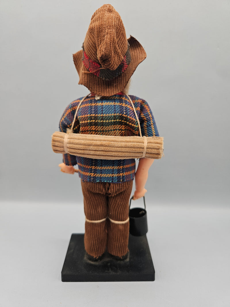 Close-up view of a vintage 8" Australian miner swagman doll, featuring a traditional hat, rugged clothing, and swag bag. The doll is a perfect representation of the iconic Australian Outback style.