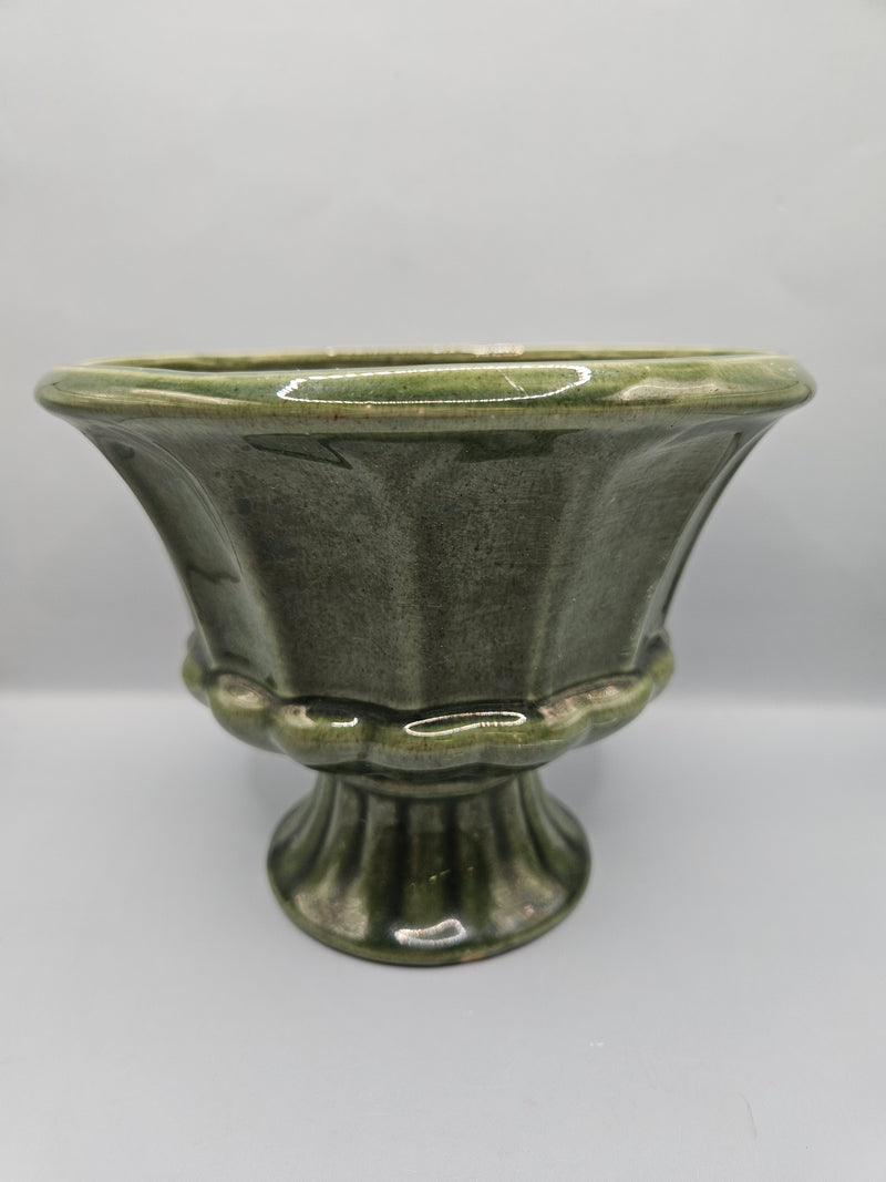 A vintage olive green ribbed pedestal planter/vase by FTD and Haeger, perfect for home decor or displaying plants, with a mid-century aesthetic.