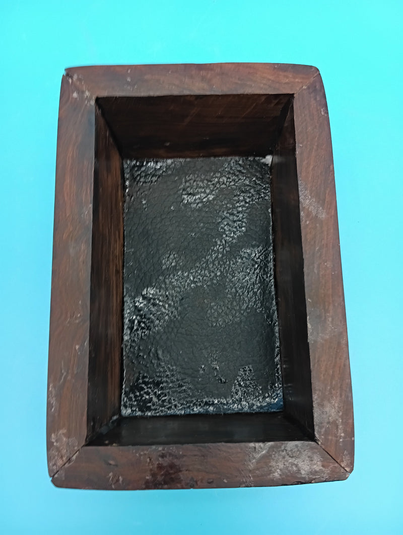 Interior of carved turtle storage box