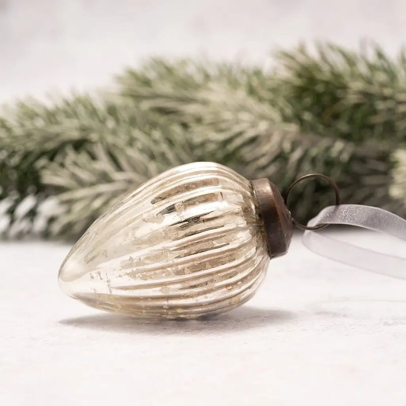 Hand-blown silver ribbed glass pinecone Christmas ornament with bronze cap and organza ribbon.