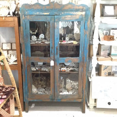 Antique painted blue cabinet with glass doors and rustic distressed finish