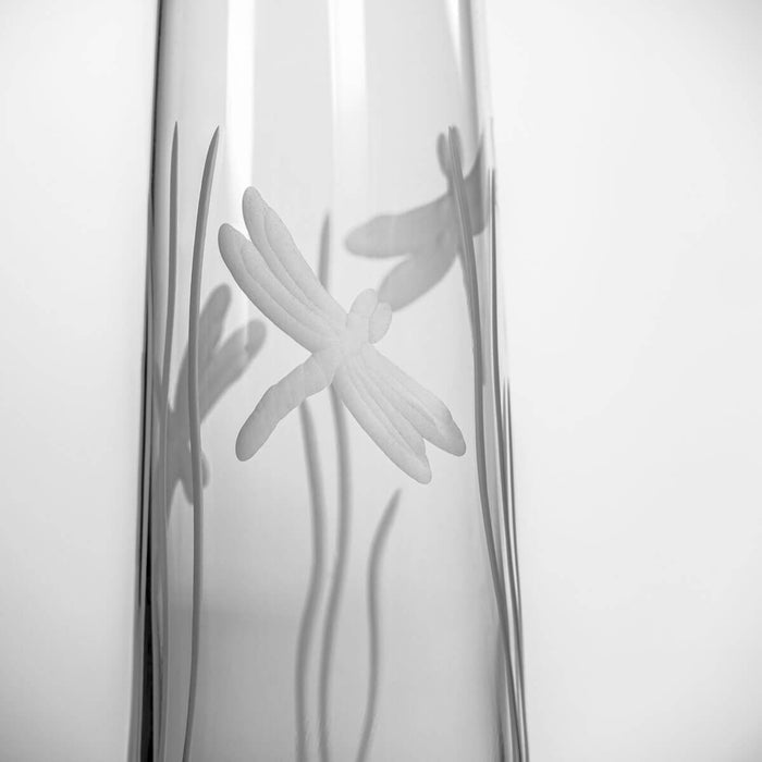 Close-up of the engraved dragonfly design on the stemless champagne flute.