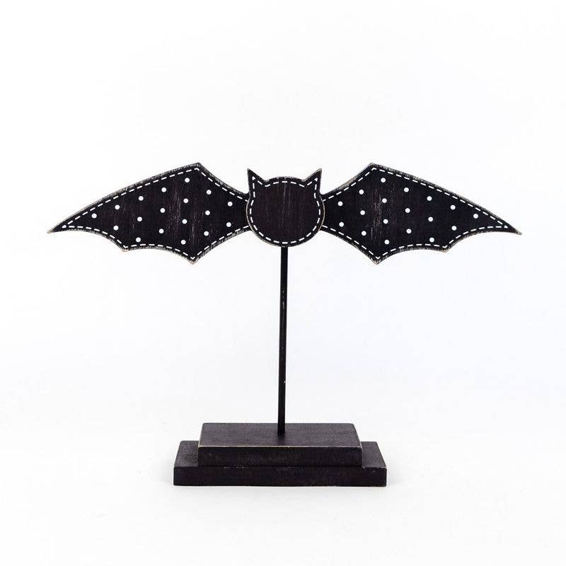 Halloween wooden bat on stand in black rustic style - seasonal holiday decoration